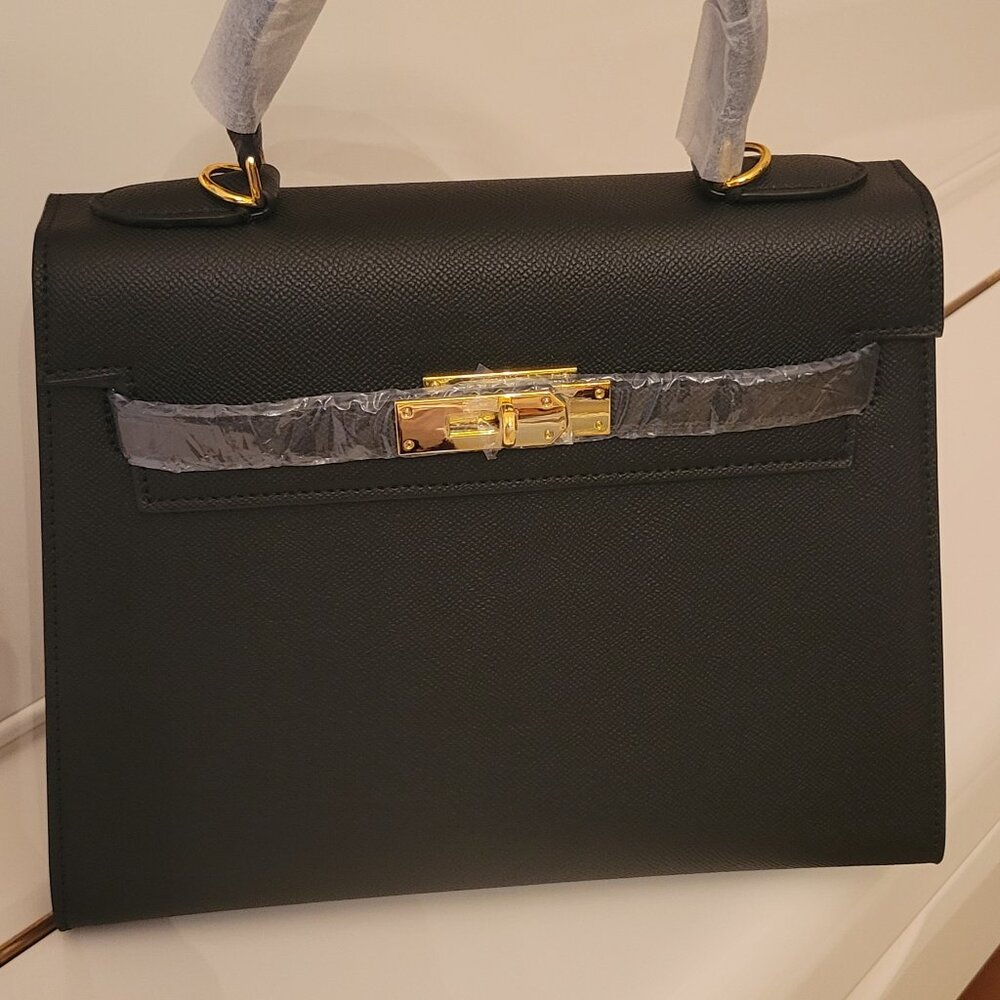 Classy! Classic black w/gold fashion bag. No brand.